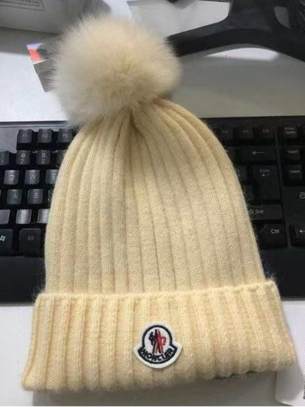 Moncler Beige hat with pom pom